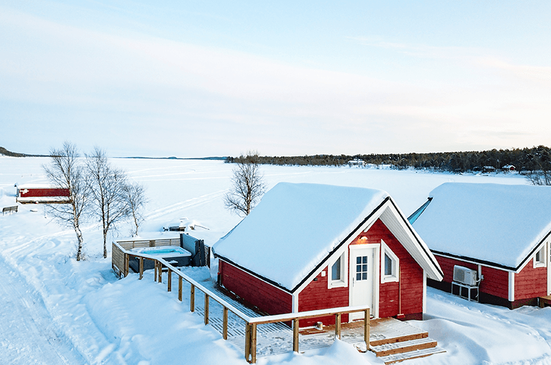 Aurora Sauna & Hot Spring in snowy landscape.